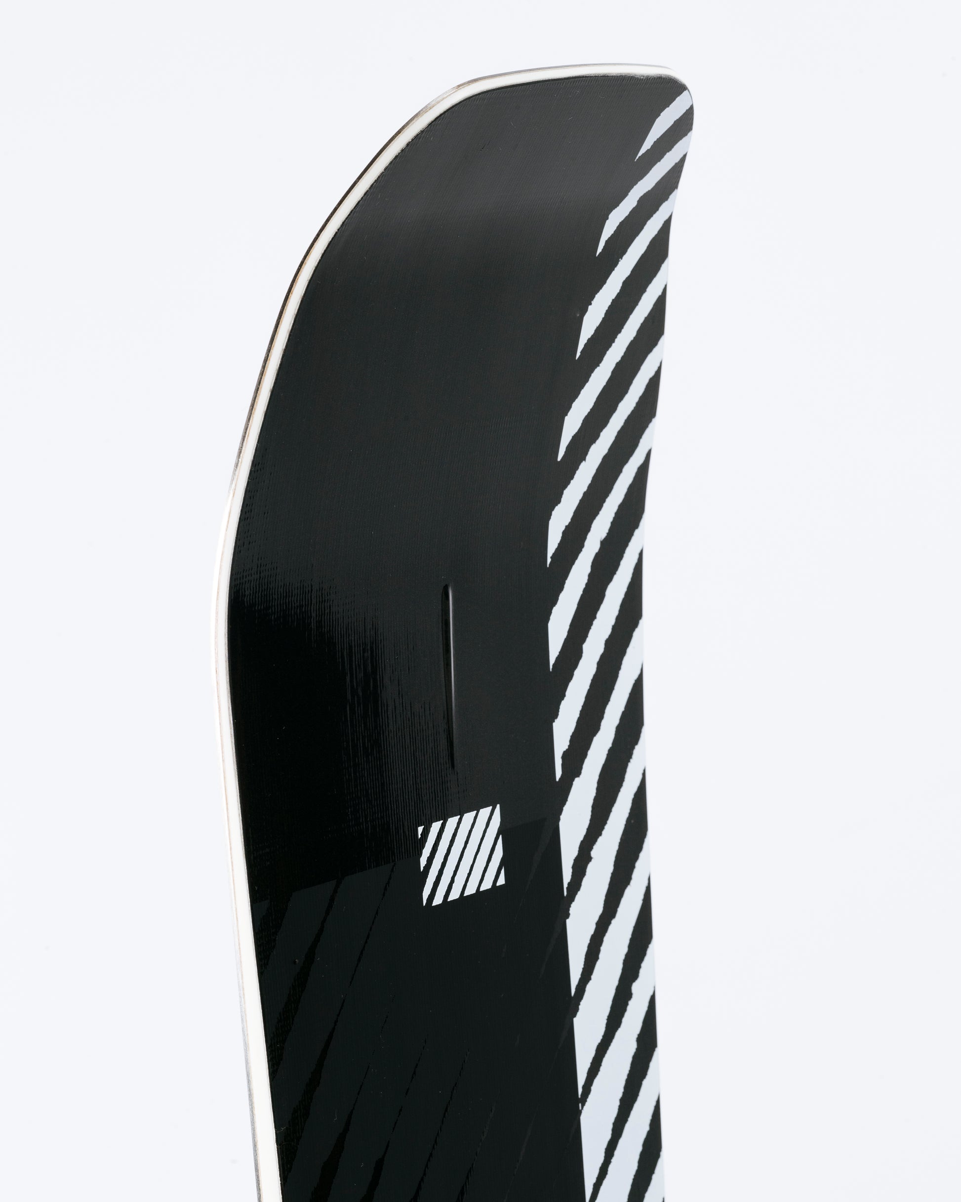 The nose of freestyle snowboard with 
Double Kick and HotRod technology visible. Agent Pro 2025 | Rome Snowboards™ 2025.