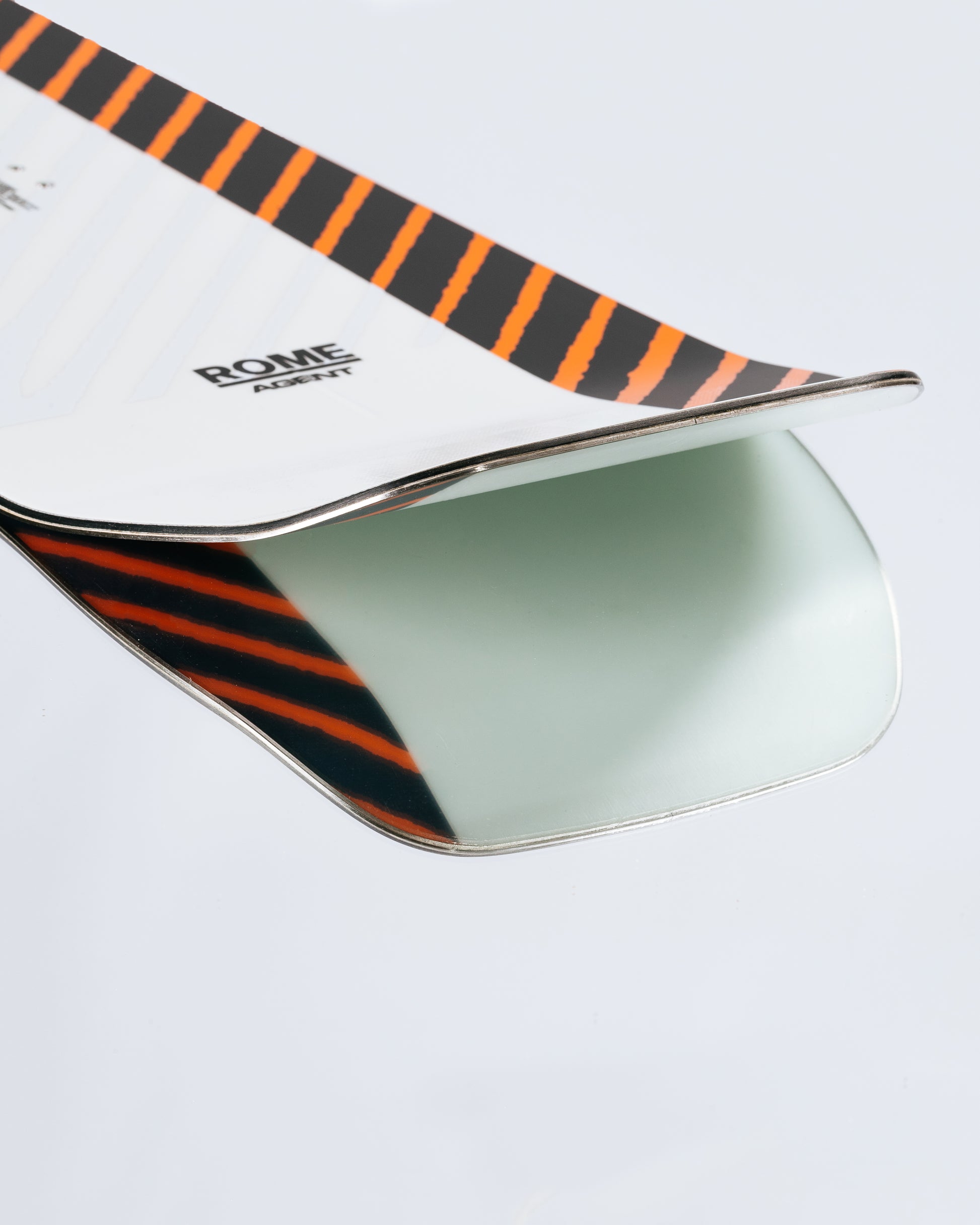 The tail and base of the freestyle snowboard with HotRods SinterStrong. Agent 2025 | Rome Snowboards™ 2025.