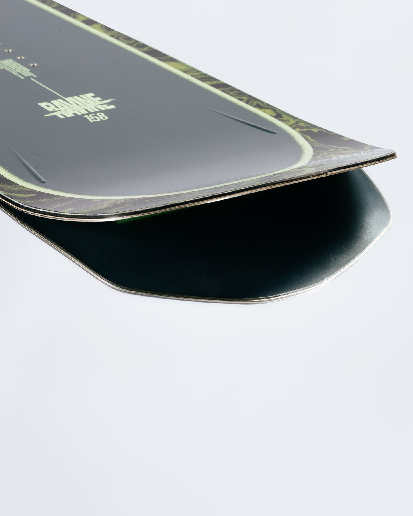 The tail and base of the powder snowboard with HotRods and SinterStrong base. Ravine 2025 | Rome Snowboards™